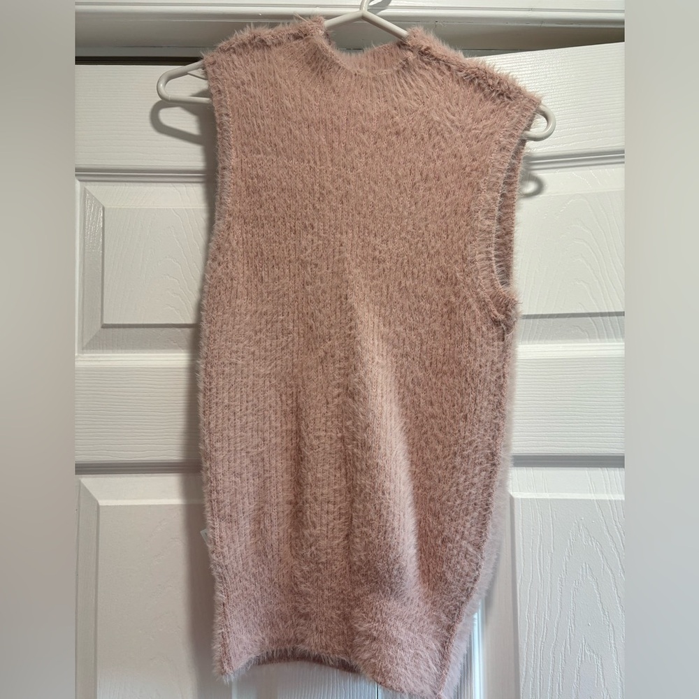 Fuzzy baby pink turtle neck vest.